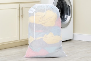 a mesh laundry bag in a laundry room