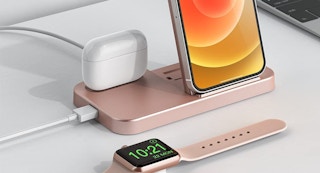 a wireless charging station with apple airpods and an iphone