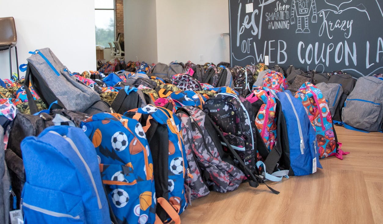 Powered by Coupons, KCL Donates 500 Backpacks to Boise Refugees