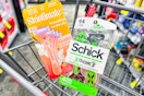 packs of skintimate and schick razors in a cart
