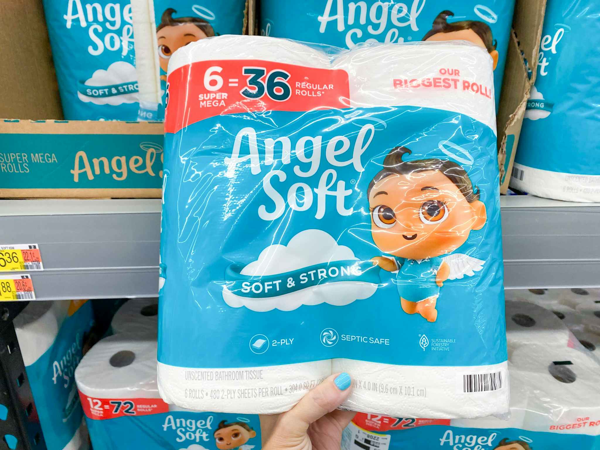 hand holding angel soft toilet paper at walmart