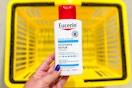 hand holding eucerin lotion