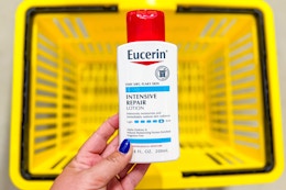 hand holding eucerin lotion