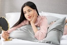 Woman laying on satin pillowcase.