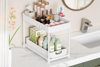 a under sink organizer in a cabinet