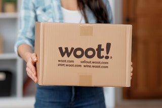 someone holding a woot box