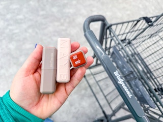 hand holding three maybelline serum lipsticks at walgreens 