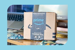 amazon box on a desk with computer