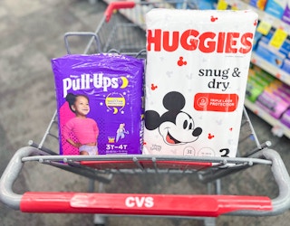 one pack of Pull Ups and one pack of Huggies diapers in shopping cart