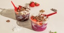cocoa haze acai bowls from Smoothie King on a table with some fruit