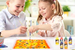 kids painting at table