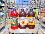 3 snapple juice bottles sitting in a walmart cart