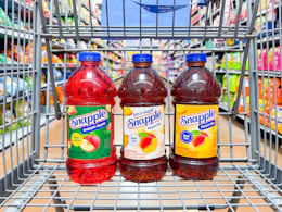3 snapple juice bottles sitting in a walmart cart