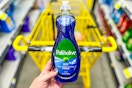 hand holding up a bottle of palmolive dish liquid