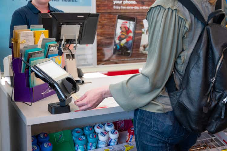Person inserting credit card at checkout in a CVS store