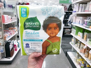 hand holding seventh generation free & clear baby wipes in a target aisle