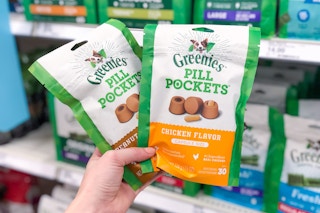 a hand holding pet pill pocket treat bags