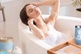 a woman using a spa gift set