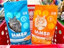2 iams dry cat food bags sitting in a target cart