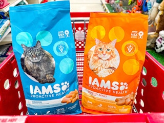 2 iams dry cat food bags sitting in a target cart