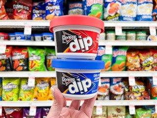 hand holding two doritos dips in target chip aisle