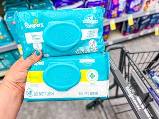 person holding baby wipe packs