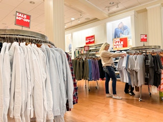 a woman looking at american eagle clearance