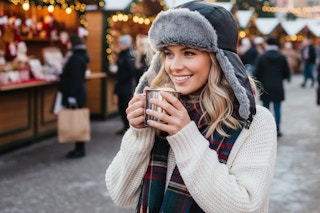 a woman wearing a trapper hat