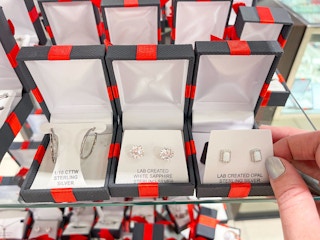 display of jewelry in red and black boxes