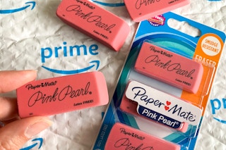 Paper Mate Pink Pearl erasers on top of an Amazon prime envelope.