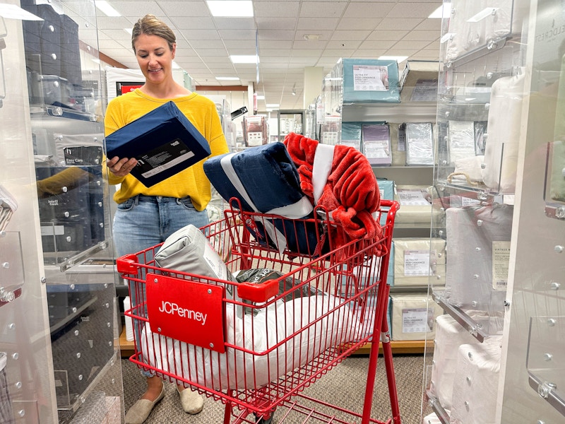 someone shopping at JCPenney with a cart