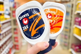 hand holding bottles of zaxbys sauce