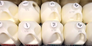 Value Corner milk in a store fridge