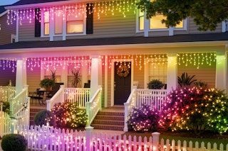 SmartDawn Smart Icicle Lights for Outside on a house lit up at night.