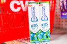 2 tubes of sensodyne kids toothpaste in front of a cvs basket