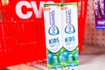 2 tubes of sensodyne kids toothpaste in front of a cvs basket