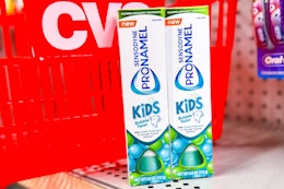 2 tubes of sensodyne kids toothpaste in front of a cvs basket