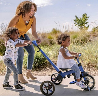 kid on a balance bike trike