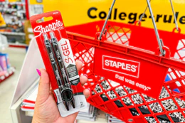hand holding a pack of Sharpie s-gel pens