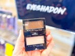 hand holding maybelline eye shadow singles