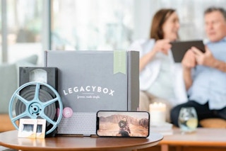 Legacybox Digital Kit for photos and more. There's a couple in the background finding their photos they want digitalized