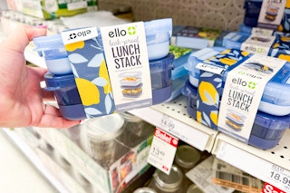 hand holding an ello lunch stack set in front of a target shelf