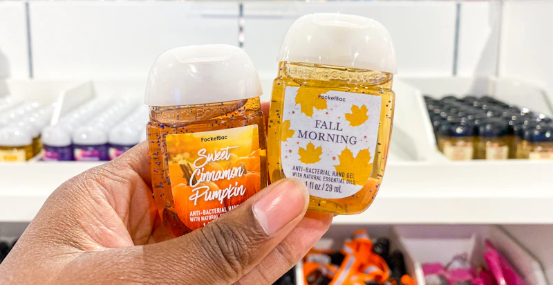 a hand holding pocket hand sanitizers