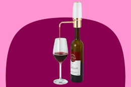 Stock image of the Automatic Wine Aerator being used on a bottle of wine