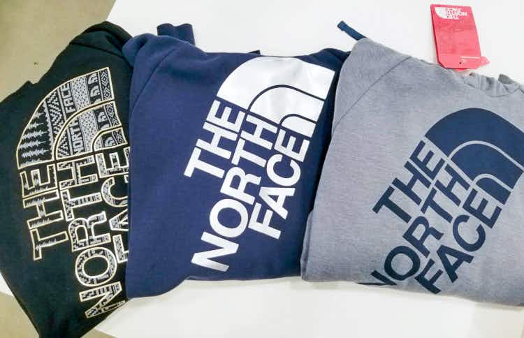 three north face logo sweatshirts folded next to each other