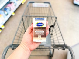 hand holding cetaphil eye serum in walgreens