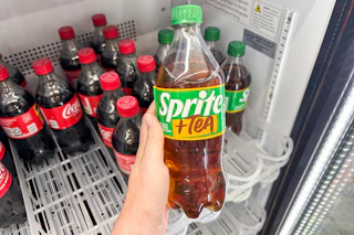 hand holding a bottle of sprite + tea at dollar general
