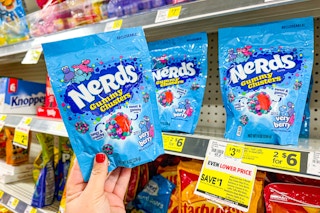 hand holding a bag of nerds gummy clusters at dollar general