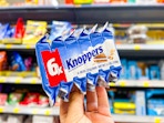 hand holding 6-count of Knoppers candy