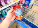 hand holding a bottle of Pepcid gummies